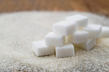 Sugar cubes on top of granulated sugar