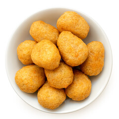 Fried breaded chilli cheese nuggets in a white ceramic bowl isolated on white from above.