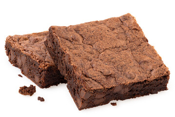 Two chocolate brownies with chocolate chips next to crumbs isolated on white.