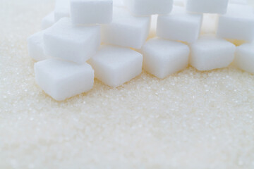 Sugar cubes on top of granulated sugar