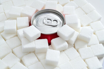 Cola can in pile of sugar cubes