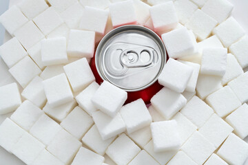 Cola can in pile of sugar cubes