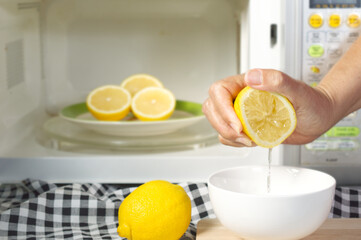 microwaving lemons for 20 - 30 seconds before squeeze make them soft and easily squeeze; kitchen...