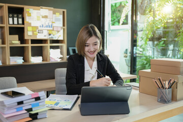 Asian businesswoman using document and notebook desk documents at the table office, business financial concept.
