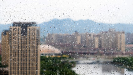 Look at the city through the raindrop window