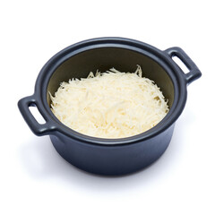 grated Parmesan cheese in black ceramic bowl isolated on white background
