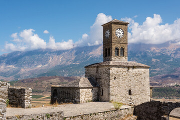 Clock tower and fortress at Gjirokaster, a beautiful town in Albania where the Ottoman legacy is clearly visible - 523991444