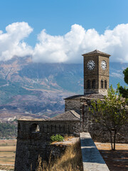 Clock tower and fortress at Gjirokaster, a beautiful town in Albania where the Ottoman legacy is clearly visible - 523991453