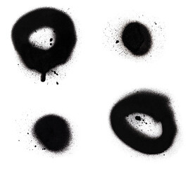 Close-up of two black spray paint spots and circles with splashes and drips, isolated on white background.