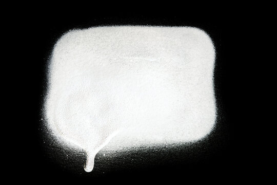 Close-up Of A White Spray Paint Rectangle Shape With Splashes And Drip, Isolated On Black Background. Copy Space.