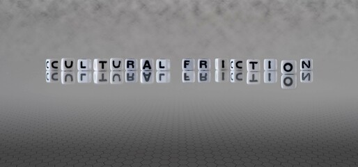 cultural friction word or concept represented by black and white letter cubes on a grey horizon...