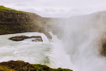 epic waterfall in Iceland mountains