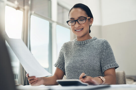 Home Budget, Finances And Bills Being Calculated By A Young Woman Sitting At Home. Young Female Calculating Her Expenses, Debt And Spendings While Doing Monthly Tax Returns Or Planning In The Lounge