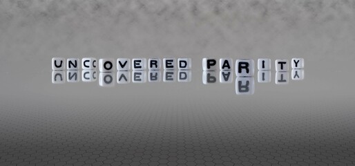 uncovered parity word or concept represented by black and white letter cubes on a grey horizon background stretching to infinity