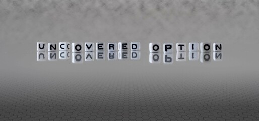 uncovered option word or concept represented by black and white letter cubes on a grey horizon background stretching to infinity