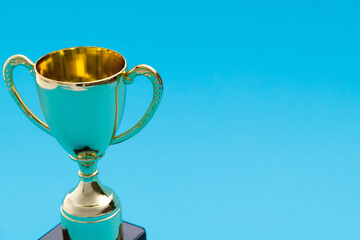 Golden trophy on blue background