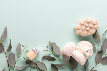 Cellulite soap, eucalyptus  and other spa objects on green background. Top view. Skin care, body treatment concept.