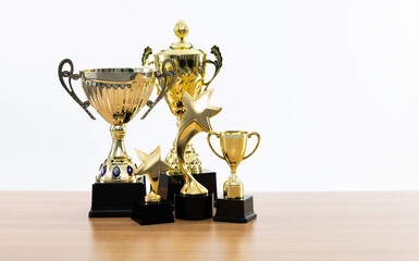 Group of trophies on wooden table