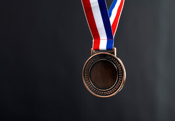 Blank bronze medal on black background
