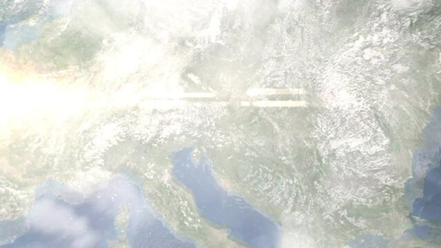 Earth zoom in from outer space to city. Zooming on Leibnitz, Austria. The animation continues by zoom out through clouds and atmosphere into space. Images from NASA