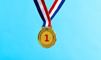 Gold medal on blue background