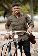 Happy business man riding a bicycle, commuting and staying active while traveling in city. Portrait...