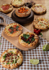 Sfiha on a wooden table with ingredients