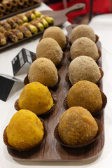 Sicilian Rice “Arancini“ displayed Row in Various Flavors, Italian Food
