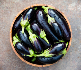 Fresh ripe eggplants in a bowl