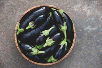 Fresh ripe eggplants in a bowl