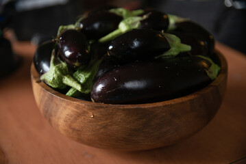 Fresh ripe eggplants in a bowl