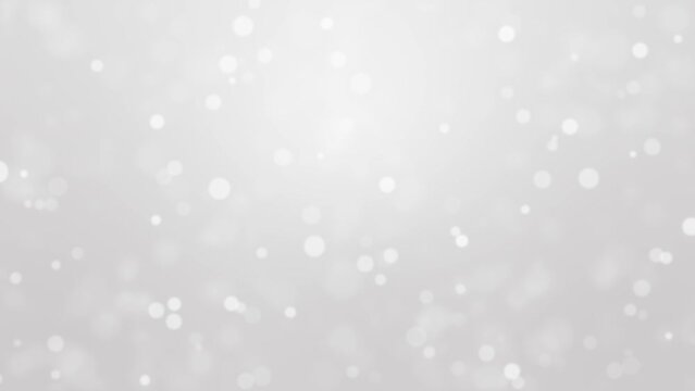 Silver festive animated background with glowing bokeh light particles.