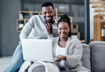 Happy couple browsing on a laptop, banking online and applying for a home loan, mortgage bond or...