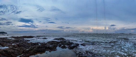 Panorama of the sea, sky and rocks.