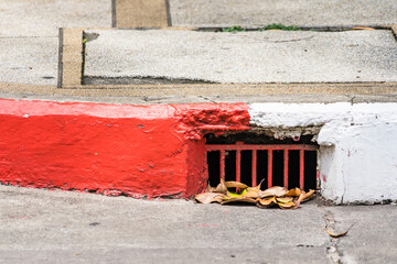 drainage system with rusty iron grating stormwater system road