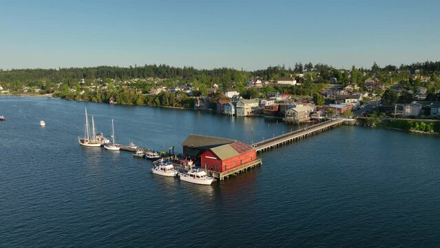 Aerial shot orbiting Coupeville's historic wharf, home to the local sailors.