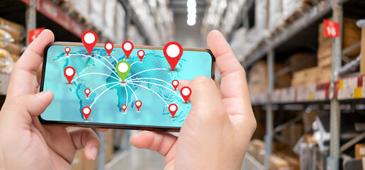Workers using smartphone cargo freight loading and tracking delivery with a mobile phone, transportation and global network