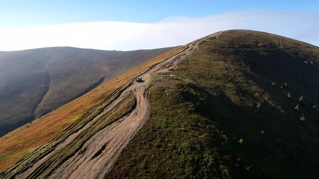 aerial view of trail road to the top of carpathian mountains