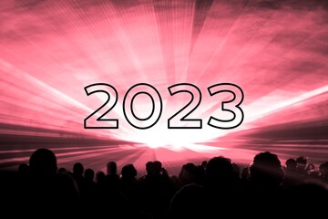 Happy new year 2023 red laser show party people crowd. Luxury entertainment with audience silhouettes turn of the year celebration. Premium nightlife event at holidays season party time