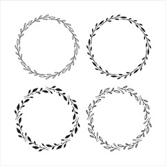 Set of 4 hand drawn spring wreaths isolated on white background, vector. Outline frames of leaves. Doodle style.Collection of floral monogram frames.