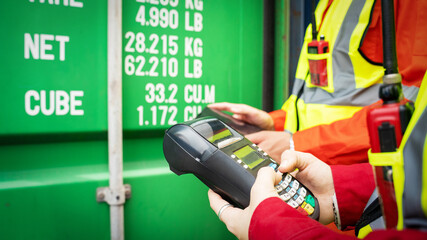 Woman foreman and Operator Using Credit Card Swipe Machine for checking code of Cargo container before import exprot concept logistics transportation shipping, Lady Foreman checking Cargo 