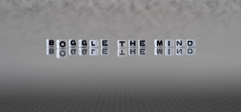 boggle the mind word or concept represented by black and white letter cubes on a grey horizon background stretching to infinity