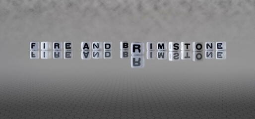 fire and brimstone word or concept represented by black and white letter cubes on a grey horizon...