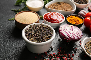 Fresh aromatic spices on dark background