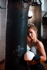 sport, boxing, woman on a sport gym background