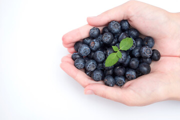 Handful of blueberries isolated on white background