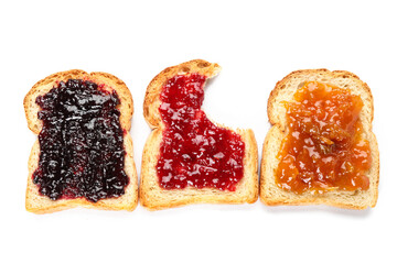 Toasts with delicious jam on white background