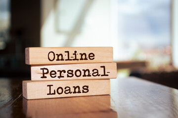 Wooden blocks with words 'Online Personal Loans'.