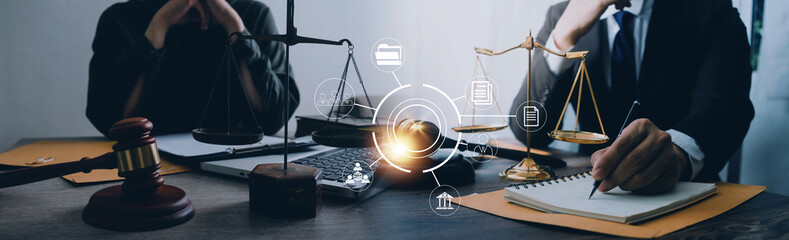 Justice and law concept. Gavel on sounding block in hand's Male judge at a courtroom, working with document law books, report the case on table in modern office.