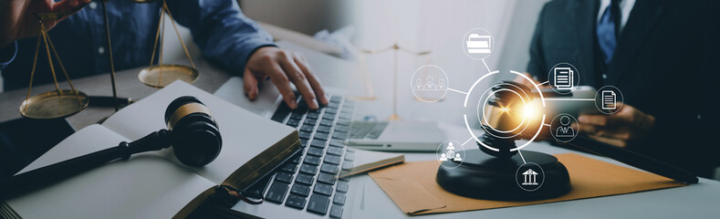 Justice and law concept. Gavel on sounding block in hand's Male judge at a courtroom, working with...